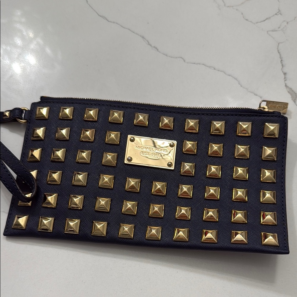Michael Kors navy blue and gold wristlet.